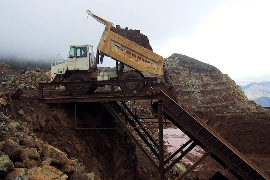 A 50-tonne truck dumps ore from New Caledonia's Ouaco nickel mine shortly before it is loaded onto freighters.