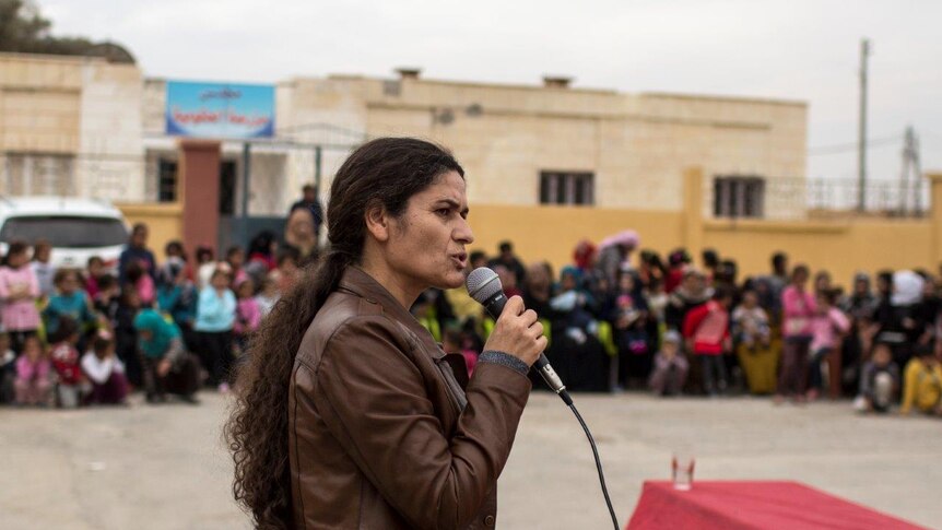 Ilham Ahmad Co-chair of Syria Democratic Council delivers a speech