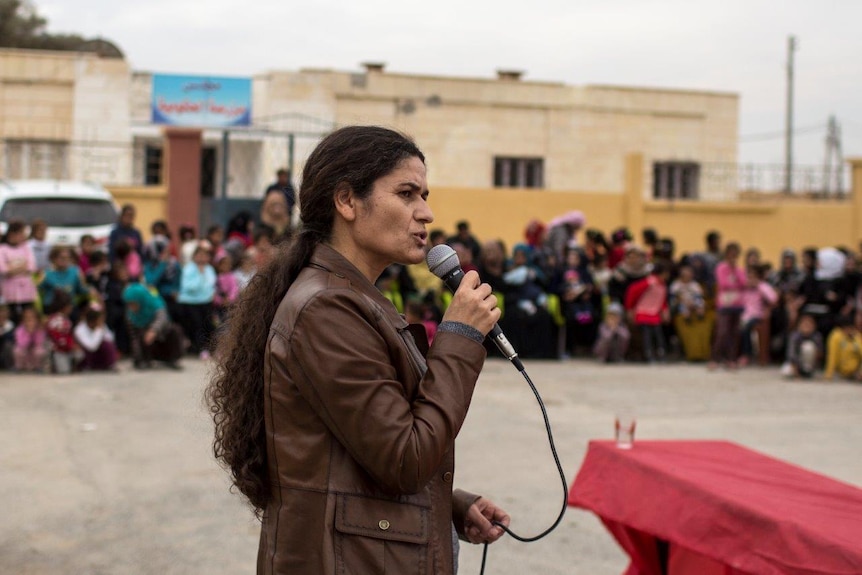 Ilham Ahmad Co-chair of Syria Democratic Council delivers a speech