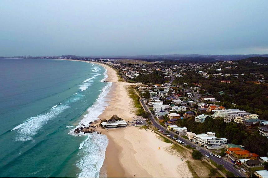 drone photo of beach and houses