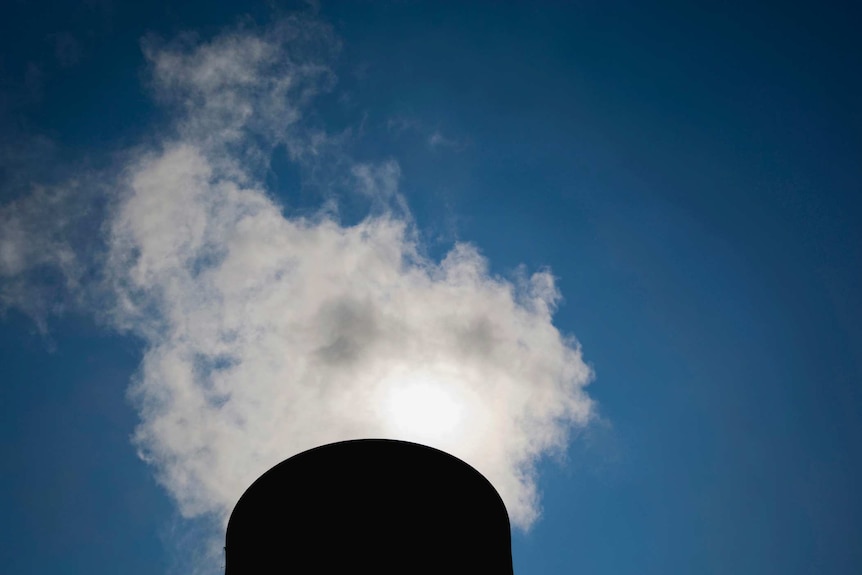 Steam rising from cooling towers at coal-fired Tru Energy Power Station, Yallourn, Victoria, Australia.