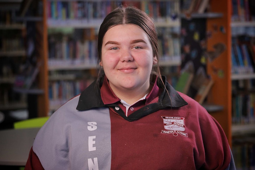 A teenage girl wearing a school uniform.