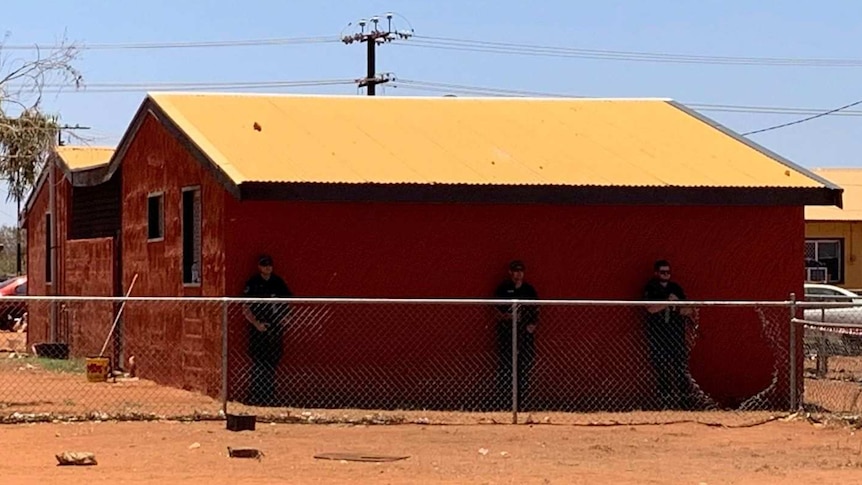 A police presence is seen at the crime scene where a teenager was shot in Yuendumu.