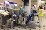 Red Cross wait at Brisbane airport with supplies for Tropical Cyclone Pam victims in Vanuatu