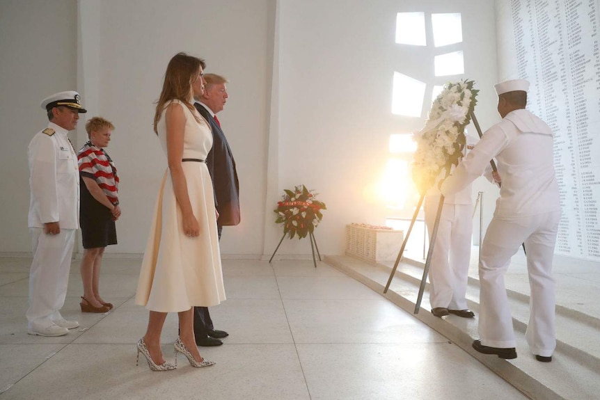 US President Donald Trump and first lady Melania Trump lay a wreath at the USS Arizona Memorial in Pearl Harbor.