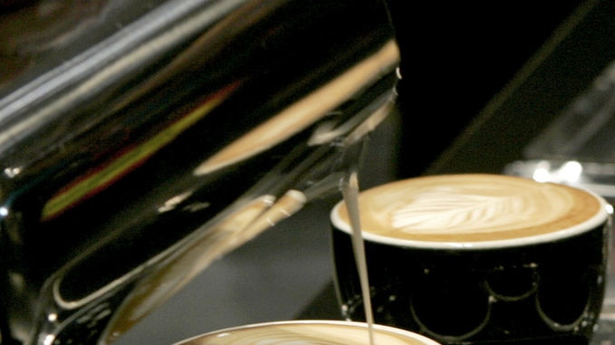 A coffee machine produces flat whites