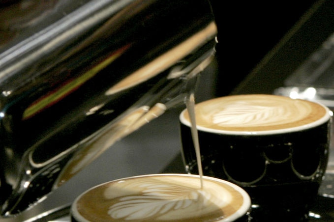 coffees being poured from a machine.