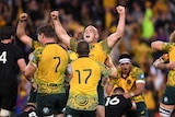 Stephen Moore is hugged by Tom Robertson after the Wallabies beat the All Blacks.