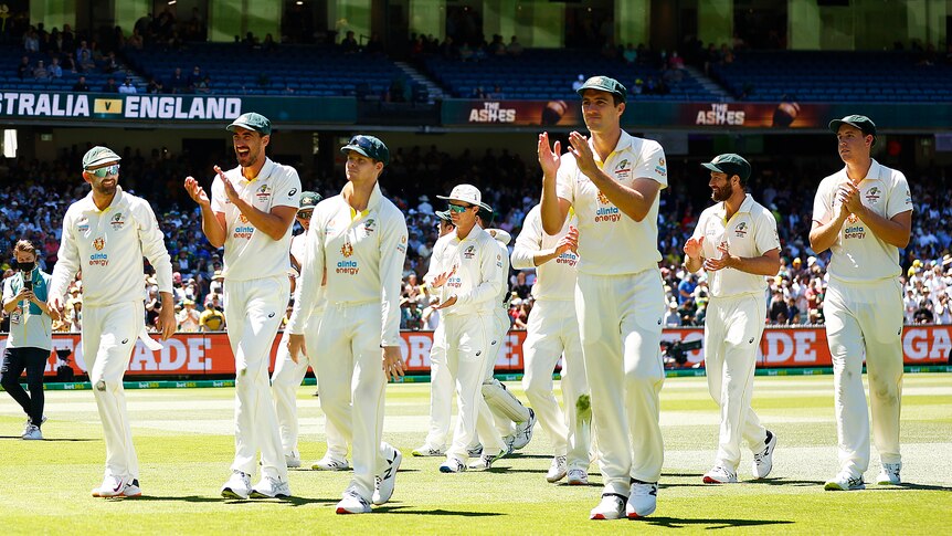 Pat Cummins and the Australian cricket team walk off the MCG after the third Ashes Test.