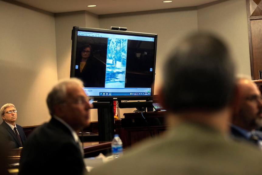 A video is played in court on a television screen.