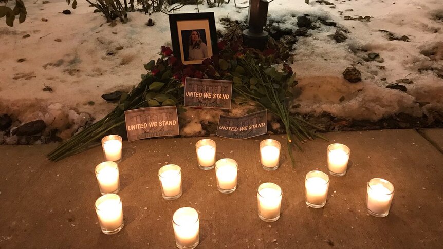 a candle lit shrine for Justine Damond.