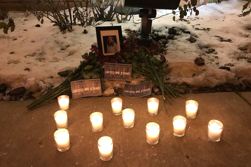 a candle lit shrine for Justine Damond.