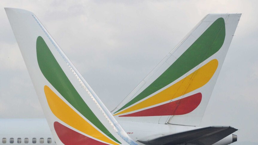 A close-up image shows two Ethiopian Airlines aircraft fins coloured in green yellow and red.