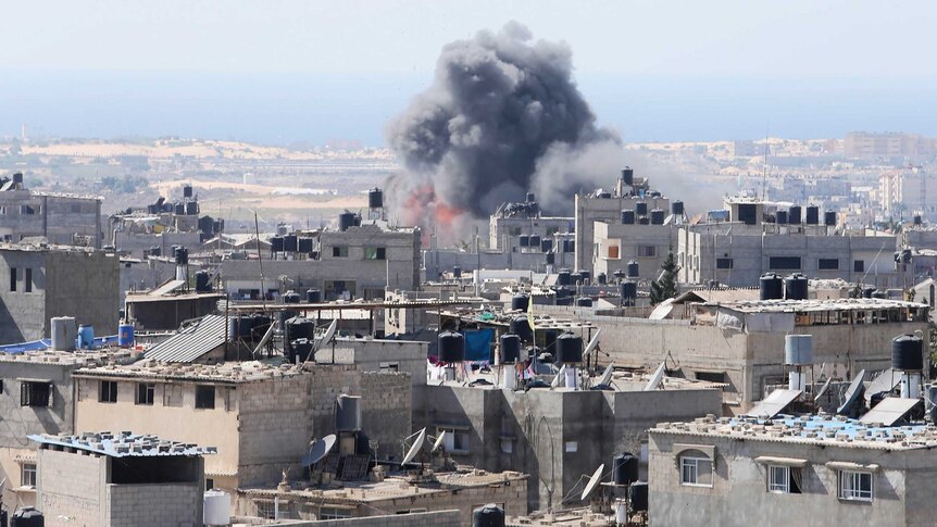 Smoke and flames are seen following Palestinian witnesses said was an Israeli air strike in Rafah in the southern Gaza Strip.