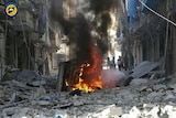 Syrians inspect damaged buildings after airstrikes by government helicopters in the rebel-held Aleppo.