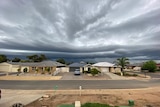 Storm clouds over new houses