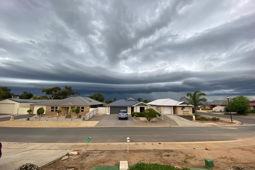 Storm clouds over new houses
