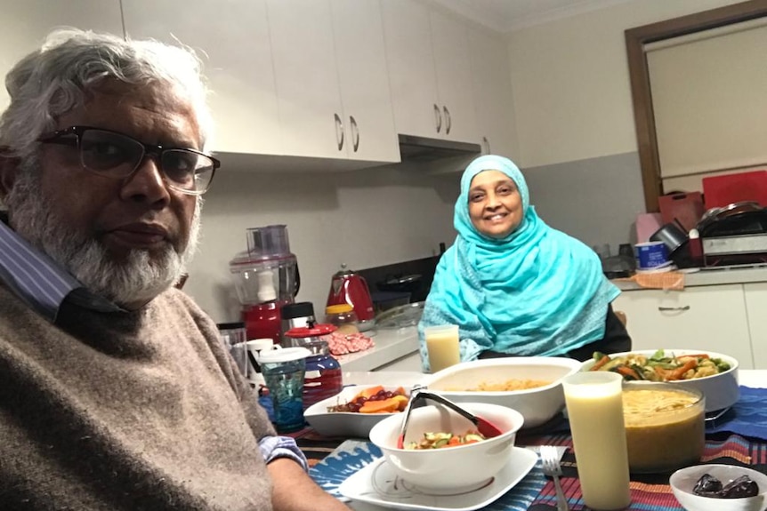 A man and woman about to have dinner in a story about Ramadan during isolation.