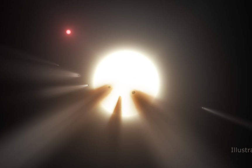 A NASA illustration shows a star behind a shattered comet