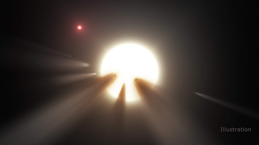 A NASA illustration shows a star behind a shattered comet