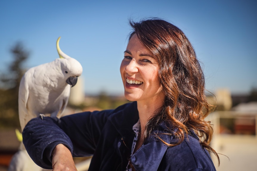 woman with cockatoo
