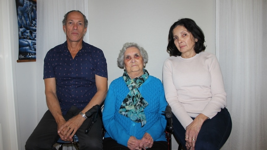 Mark and Patricia sit either side of Joan Ford.