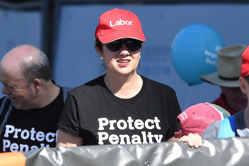 Ms Palaszczuk joined unions at the parade, where she announced the new labour hire scheme.