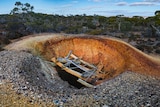 A hole in the ground left by a mining company in the Great Western Woodlands