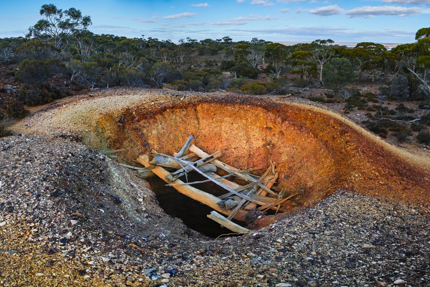 A hole in the ground left by a mining company in the Great Western Woodlands