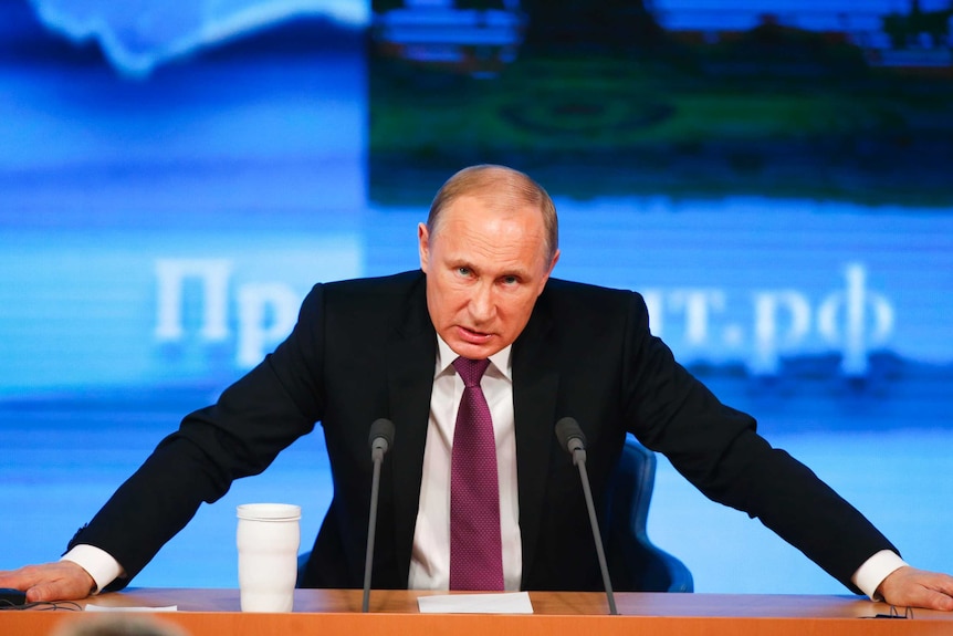 Russian President Vladimir Putin speaks during his annual end-of-year news conference in Moscow, December 18, 2014