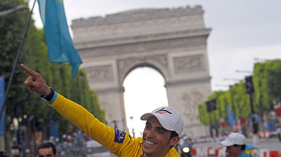 Alberto Contador parades with team-mates on the Champs-Elysees.