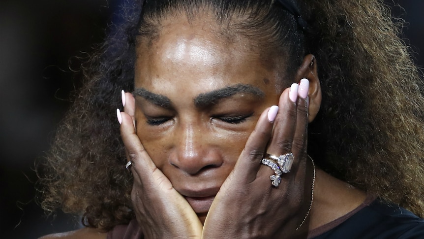 Serena Williams reacts during the trophy ceremony after the US Open women's final.