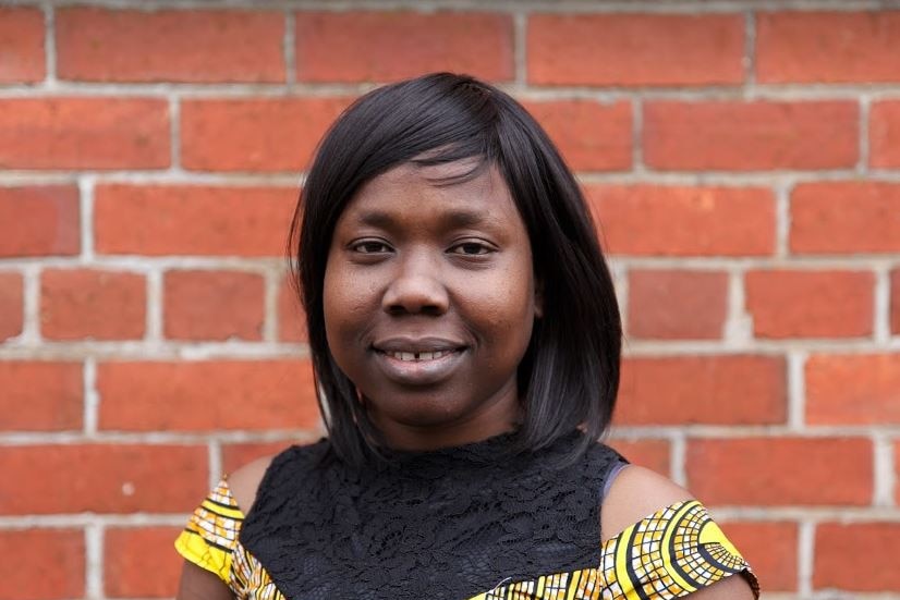 Nene Manasseh from South Sudan in yellow dress.