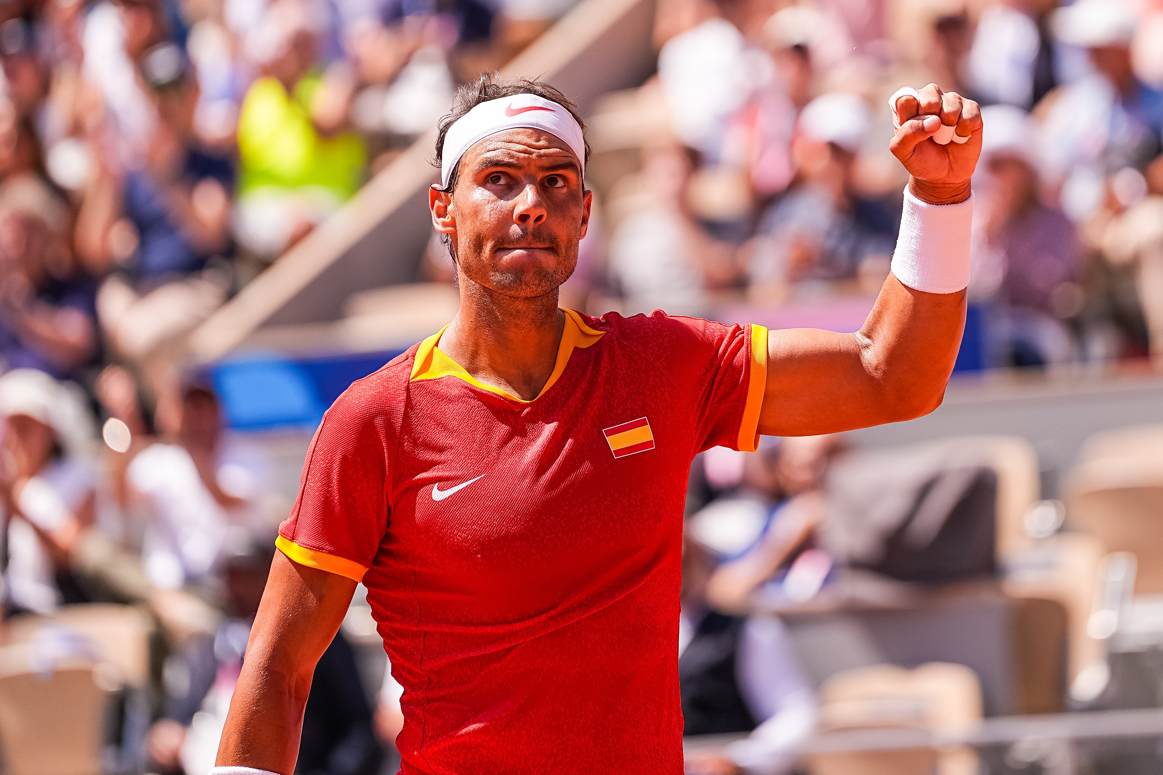 Nadal raises his fist in the air in triumph at the Paris Olympics