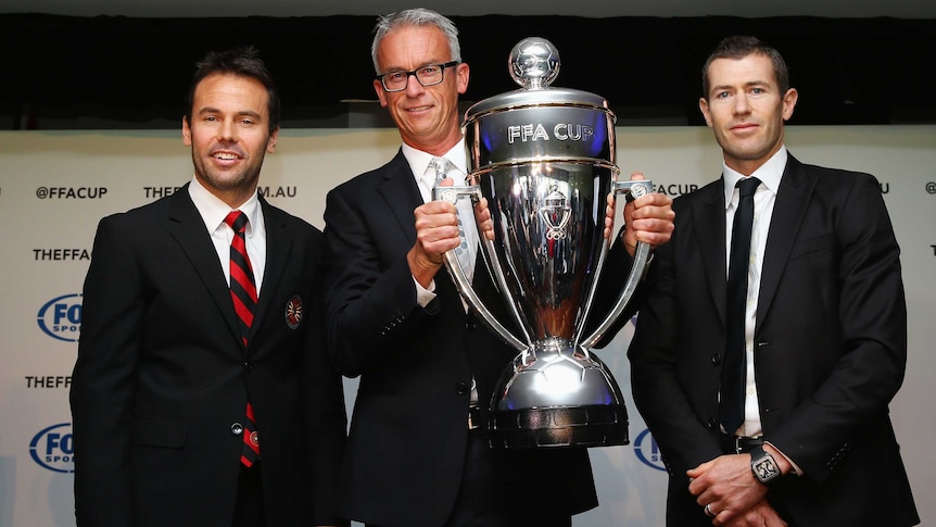 Rockdale City Suns' Paul Reid, FFA chief executive David Gallop and Brett Emerton with the FFA Cup.