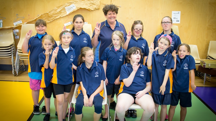 Diana Sully standing with members of the Riverland Special School Girl Guides unit.