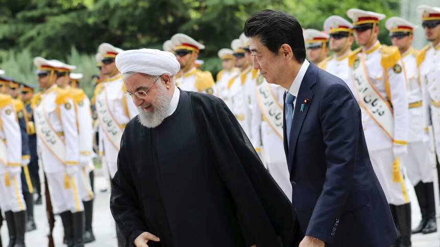 Iranian President Hassan Rouhani, left, and Japanese Prime Minister Shinzo Abe, right, in Tehran.