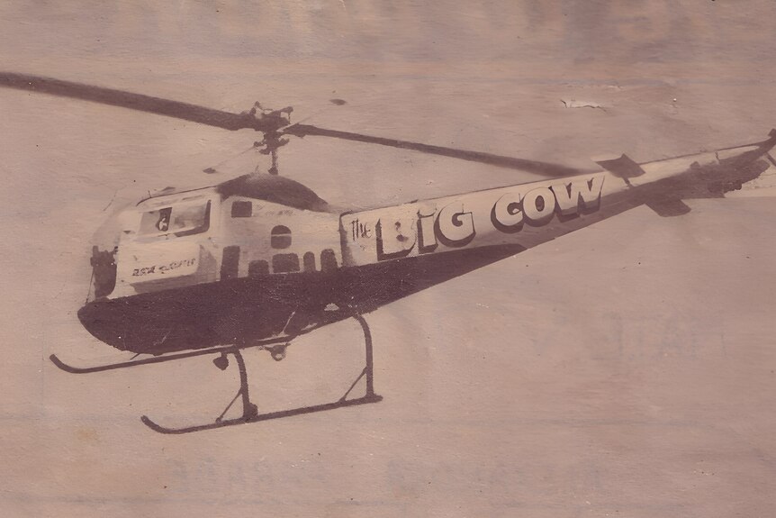 A helicopter with the Big Cow written on it.