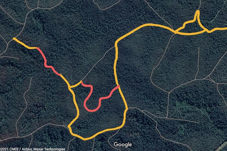 A coloured topography map of a national park with yellow and red lines to mark a paths