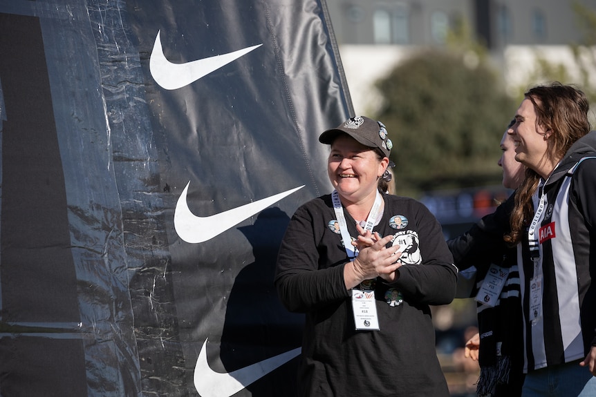 Fearn Harrison smiles and claps her hands.