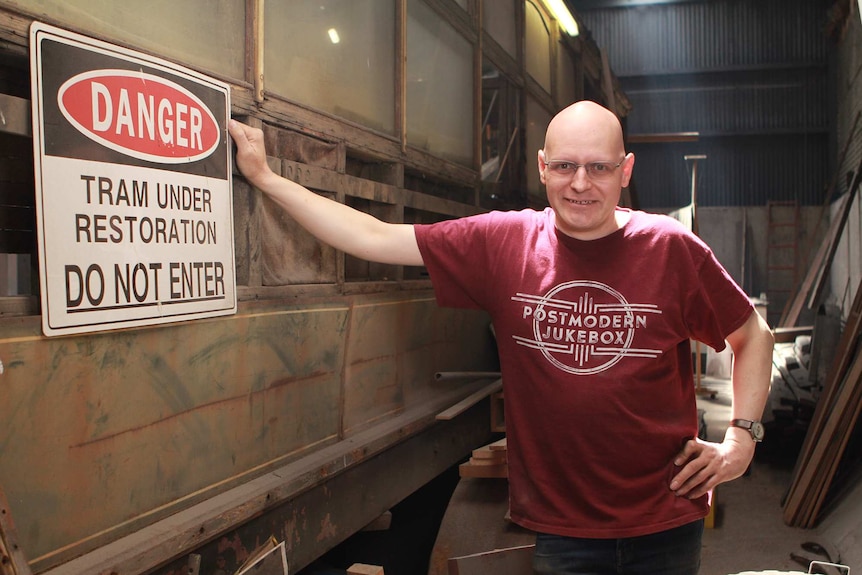 Tram enthusiast Jeremy Kays with an old Hobart tram.