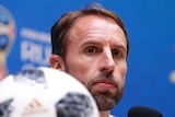 England head coach Gareth Southgate listens to a question during a media conference.
