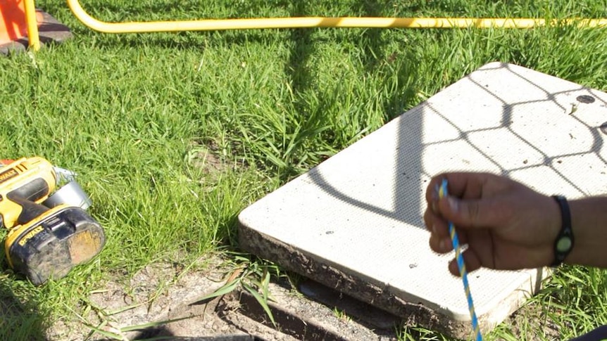 A communications construction worker at work