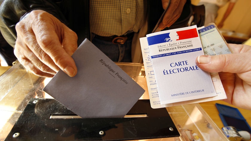 A voter casts his ballot in the first round of the French presidential election.