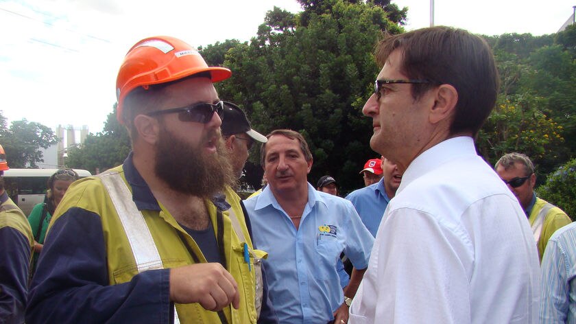 Federal Climate Change Minister Greg Combet talks to a worker at the Port Kembla steelworks in the NSW.