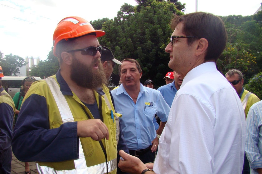 Federal Climate Change Minister Greg Combet talks to a worker at the Port Kembla steelworks in the NSW.