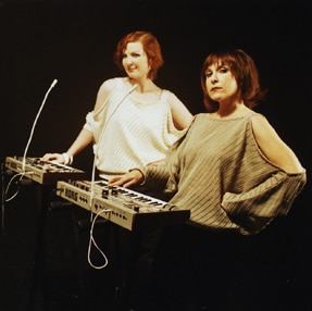 Two women with 20th century synthesisers