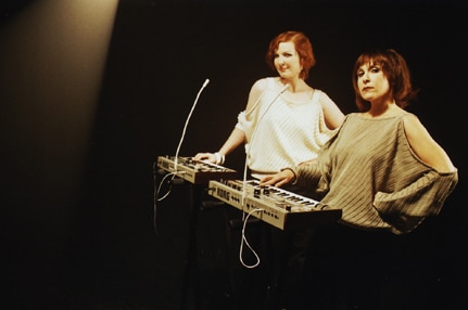 Two women with 20th century synthesisers
