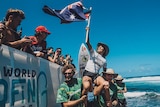 Sally Fitzgibbons waves an Australian flag