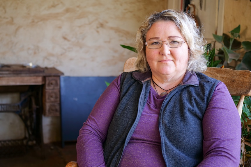 Northampton woman Wren Fisher sitting in a chair outside her historic Northampton home, May 2021.